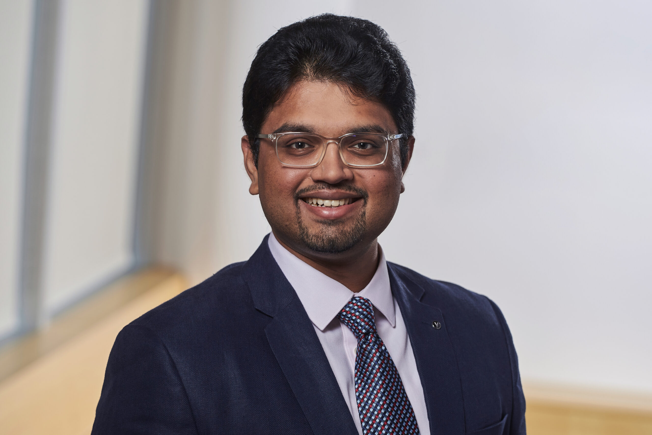 Headshot of Rishabh Rajiv Ramamurti, smiling.