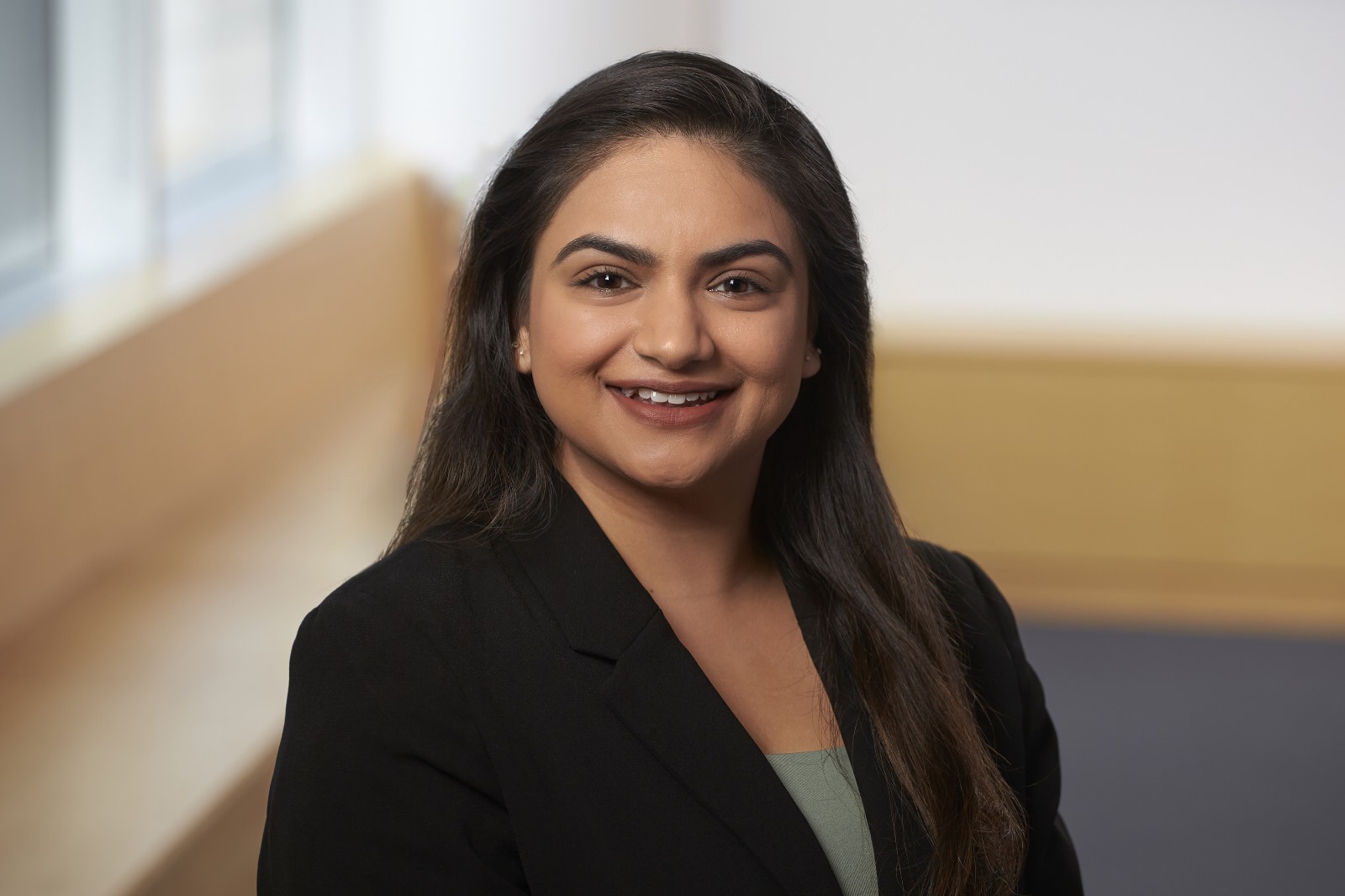 Headshot of Ashruti Patel, smiling.